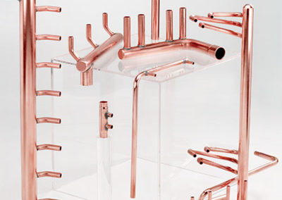 Many different collections of copper piping with odds and ends as attachments made by Spinco Metal Products Inc in Newark, NY